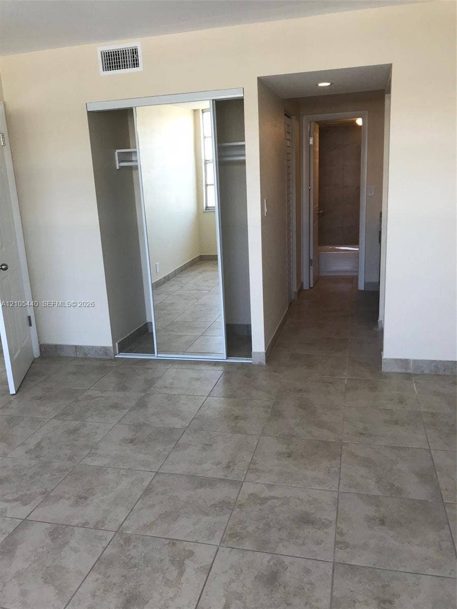 16710 NE 9th Avenue, #707, North Miami Beach, North Miami Beach, FL 33162 Tile flooring with a neutral finish, mirrored closet doors, and recessed lighting