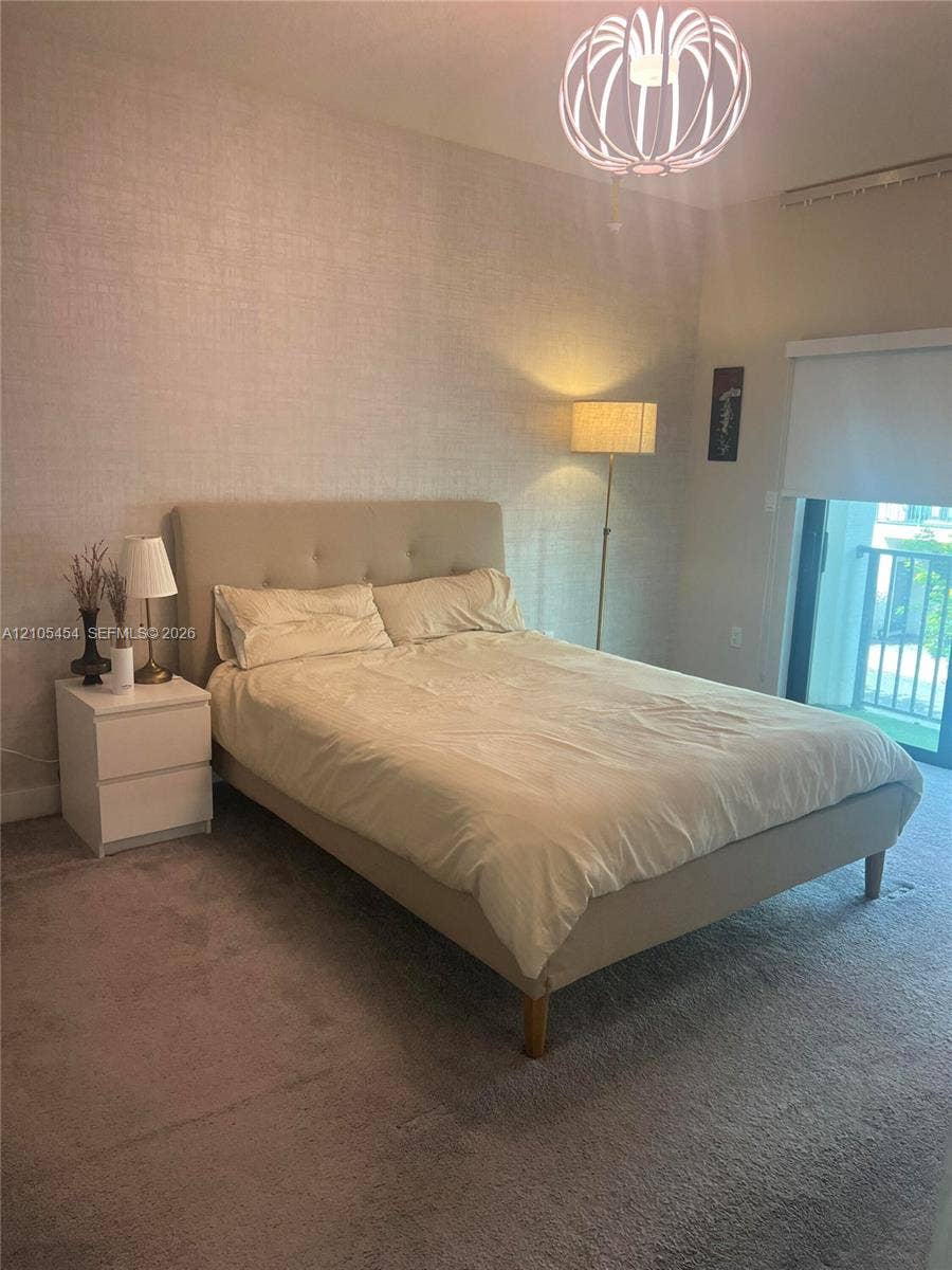 4745 NW 84th Court, #20, Doral, FL 33166 Plush carpeted flooring, textured wall covering, and a modern geometric ceiling light fixture
