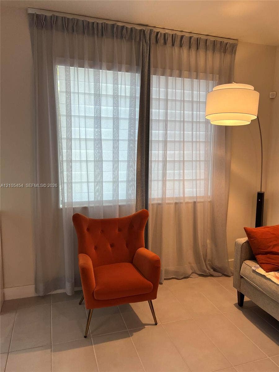 4745 NW 84th Court, #20, Doral, FL 33166 Dual windows with sheer privacy shades and full-length drapery