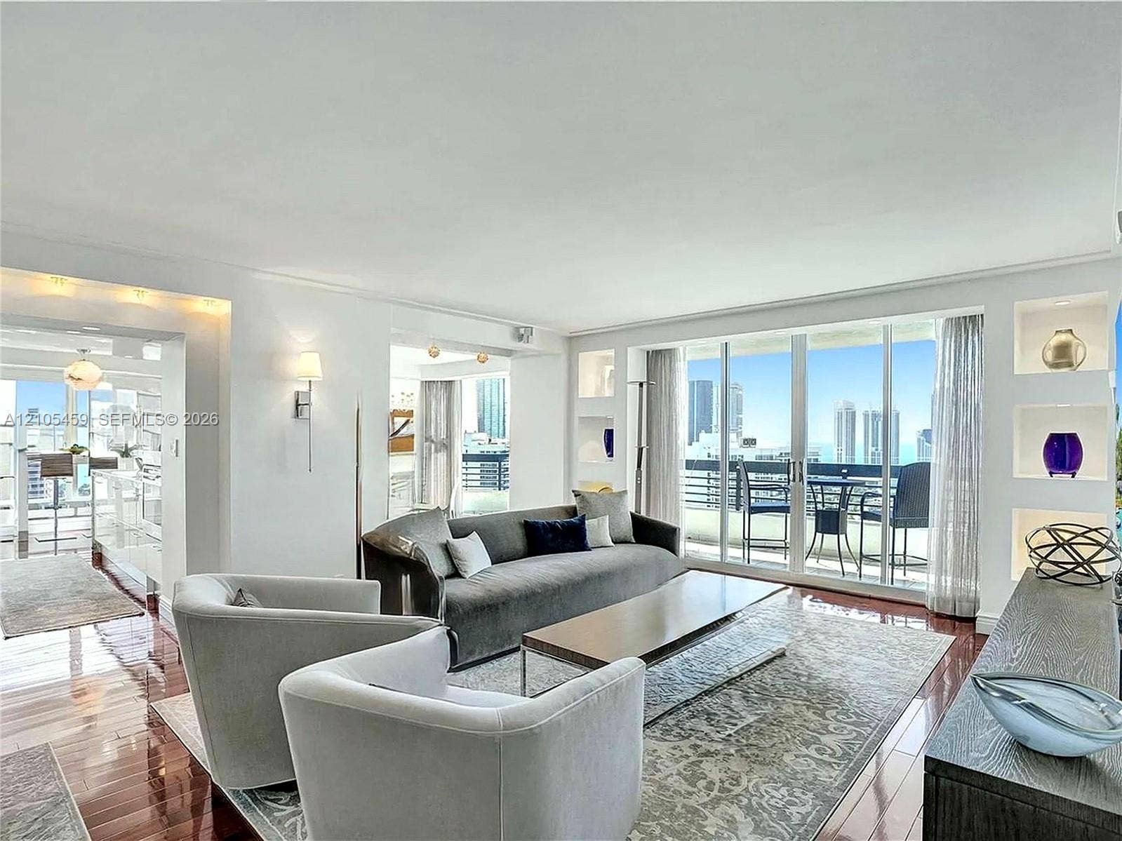 Expansive living area with wood-finish flooring