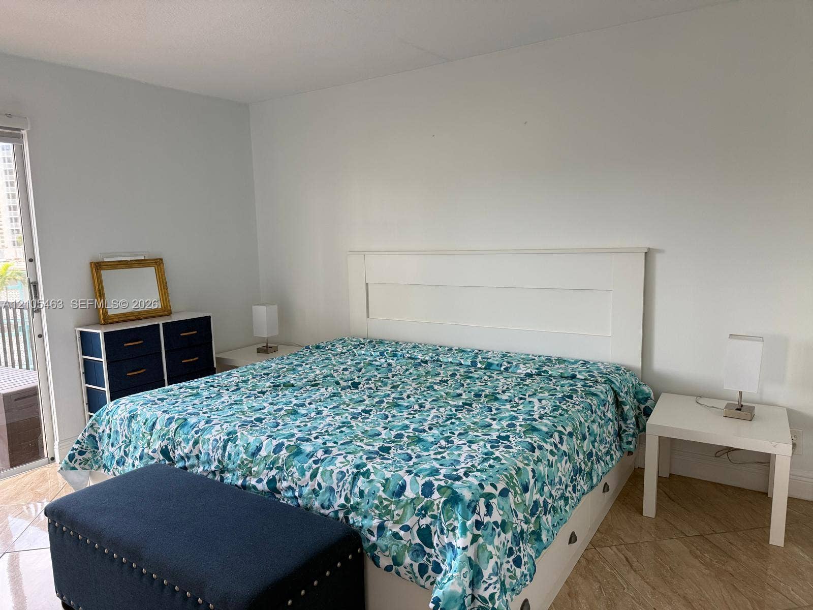 White walls with a tall headboard
