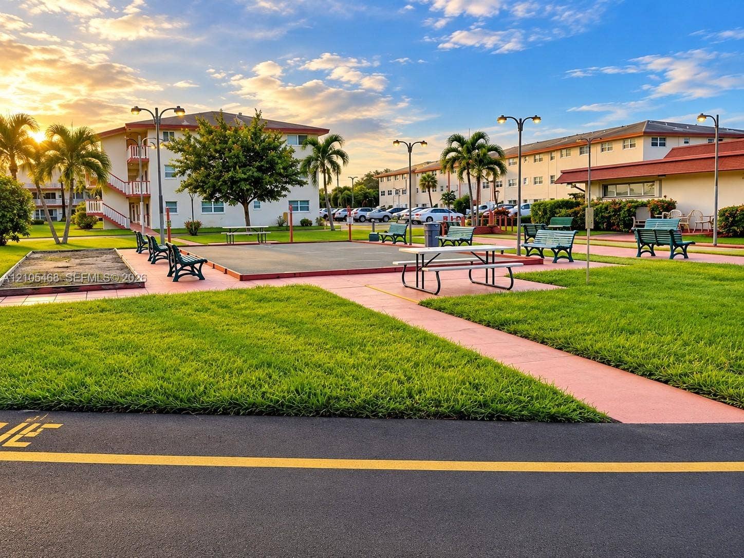 5300 Washington Street, #I201, Hollywood, FL 33021 Expansive green spaces with paved walkways and mature palm trees