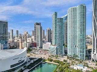 888 Biscayne Boulevard, #811, Miami, FL 33132 Expansive cityscape featuring modern high-rise architecture and a prominent waterfront