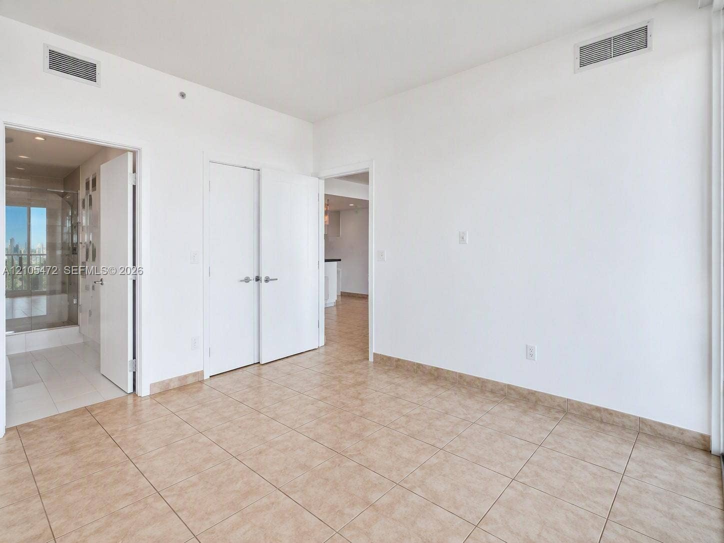 888 Biscayne Boulevard, #811, Miami, FL 33132 Neutral-toned tile flooring, white interior doors, and recessed ceiling lighting