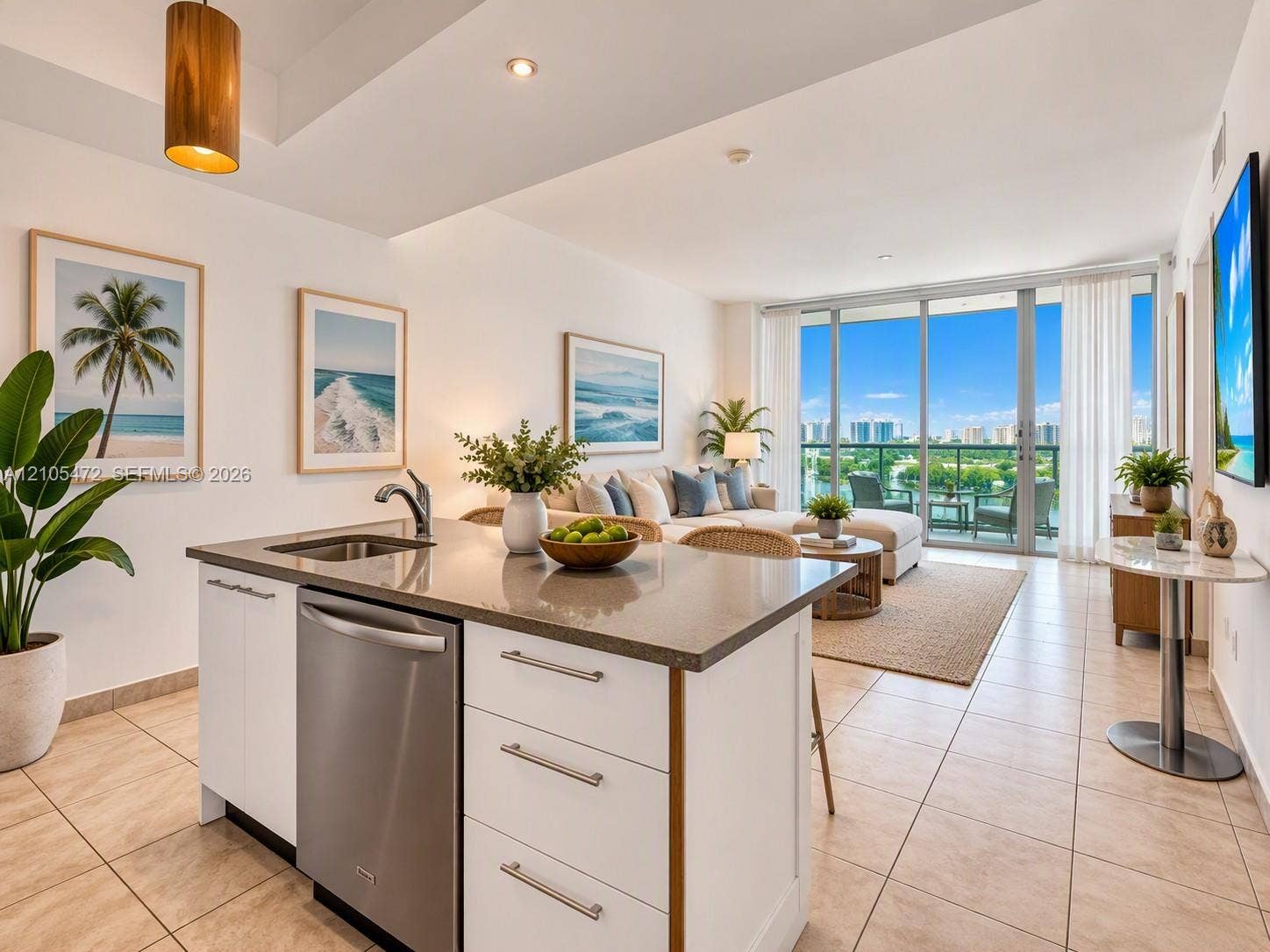 888 Biscayne Boulevard, #811, Miami, FL 33132 Kitchen island featuring a neutral-tone countertop, stainless steel dishwasher, and built-in cabinetry with metallic pulls-AI Virtual Stage Image
