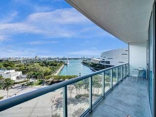 888 Biscayne Boulevard, #811, Miami, FL 33132 Balcony with a glass railing, concrete flooring, and water scenery