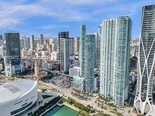 888 Biscayne Boulevard, #811, Miami, FL 33132 Vast cityscape with numerous high-rise buildings, including distinctive architectural structures