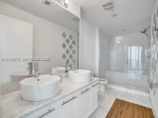 888 Biscayne Boulevard, #811, Miami, FL 33132 Dual vessel sinks with chrome fixtures set into a light-toned countertop