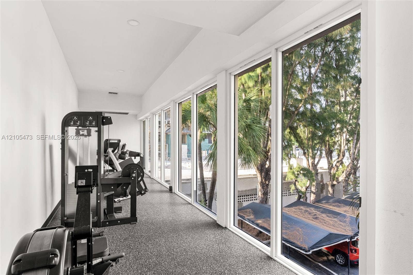 770 NE 69th Street, #6F, Miami, FL 33138 Floor-to-ceiling windows, high ceilings with recessed lighting, and resilient textured flooring