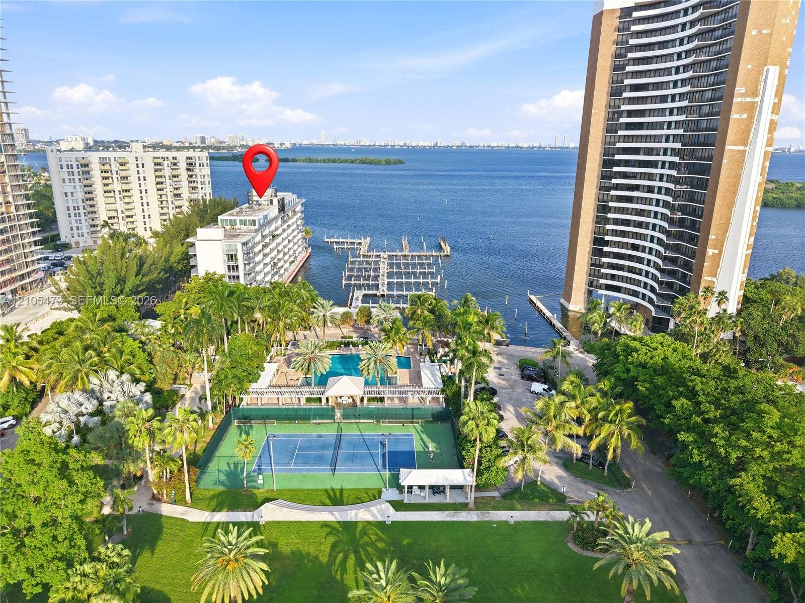 770 NE 69th Street, #6F, Miami, FL 33138 Waterfront property featuring a tennis court, swimming pool, and boat docks