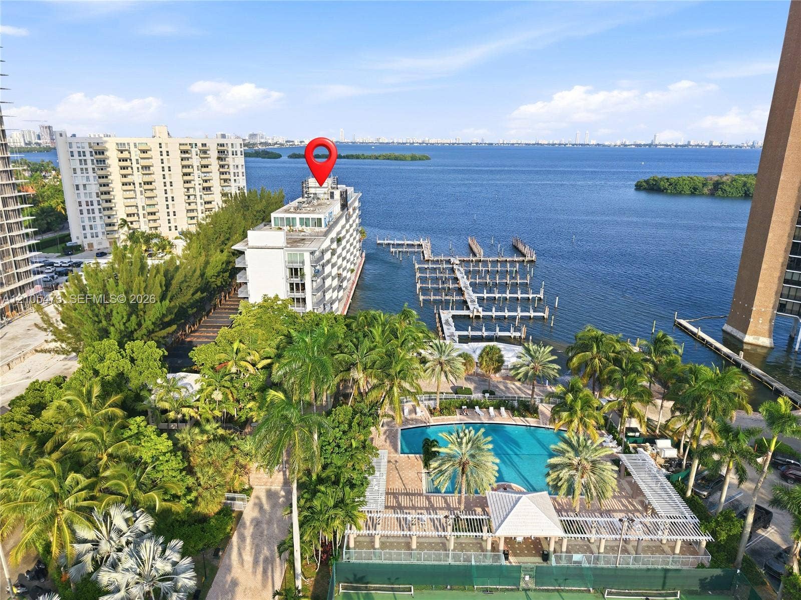 770 NE 69th Street, #6F, Miami, FL 33138 Waterfront property featuring extensive boat slips, a swimming pool, and a tennis court