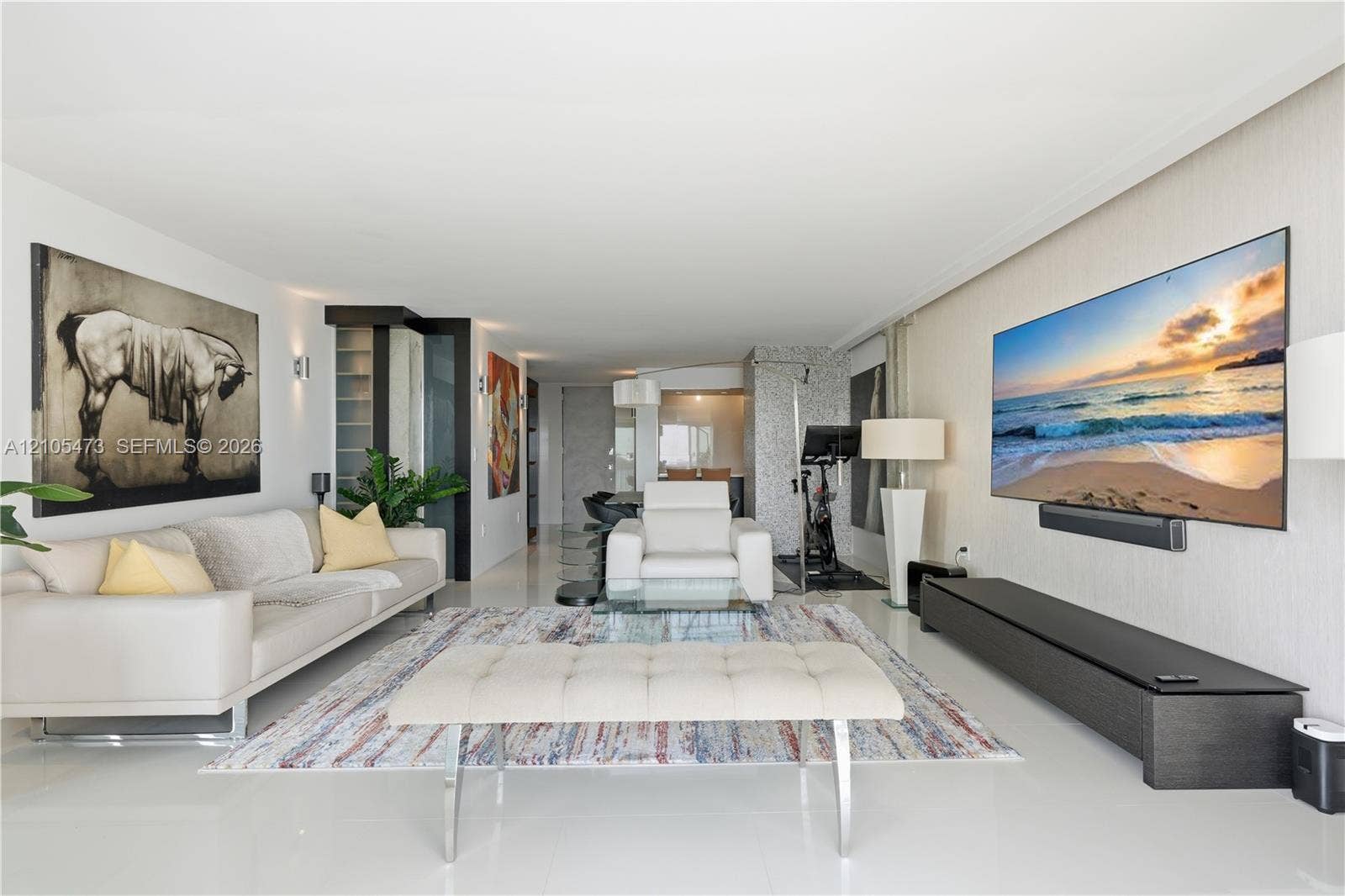 770 NE 69th Street, #6F, Miami, FL 33138 Recessed lighting illuminates the open-concept living space with white flooring