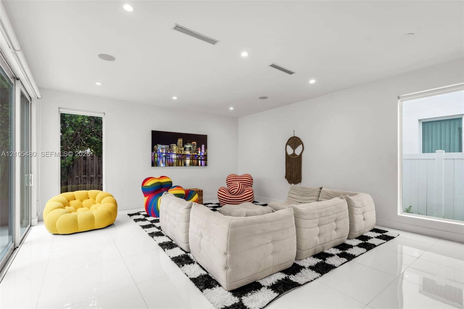 White tile flooring, recessed lighting, sliding glass door, and a large window
