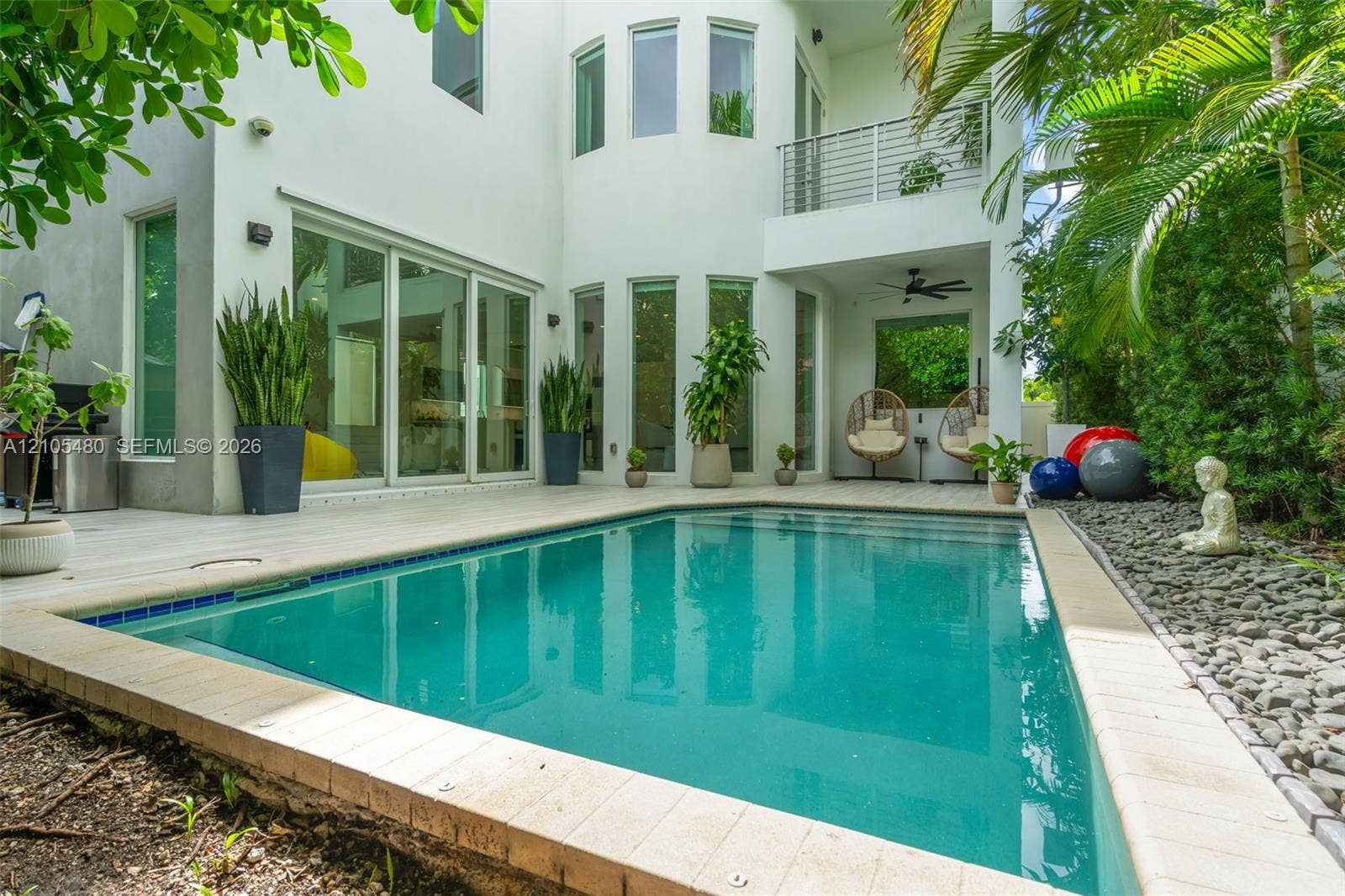 Outdoor swimming pool with tile surround