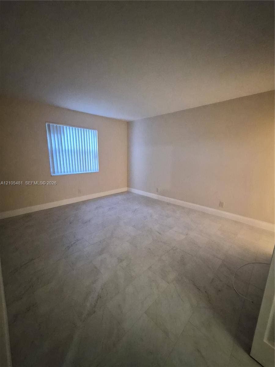 10909 Royal Palm Boulevard, #10909, Coral Springs, Coral Springs, FL 33065 Hard surface flooring, neutral wall tones, and horizontal blinds