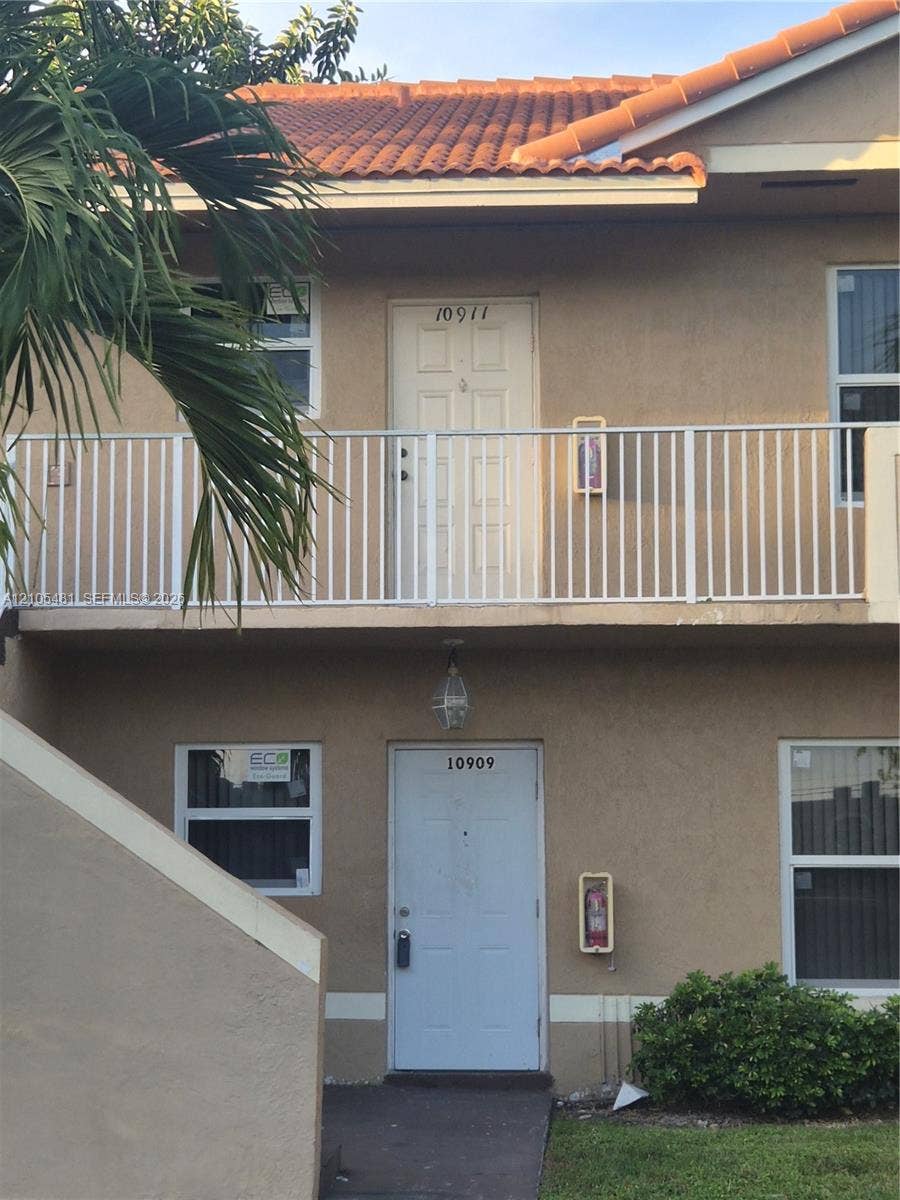 10909 Royal Palm Boulevard, #10909, Coral Springs, Coral Springs, FL 33065 Stucco exterior with a terracotta tile roof