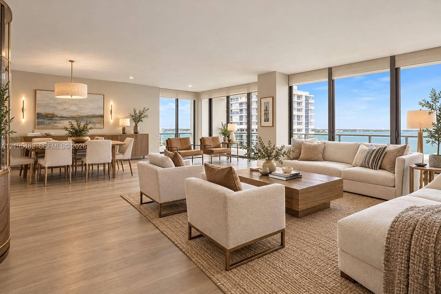 2100 S Ocean Lane, #808, Fort Lauderdale, FL 33316 Open-concept interior featuring floor-to-ceiling windows, wood-finish flooring, recessed lighting, and wall-mounted sconces