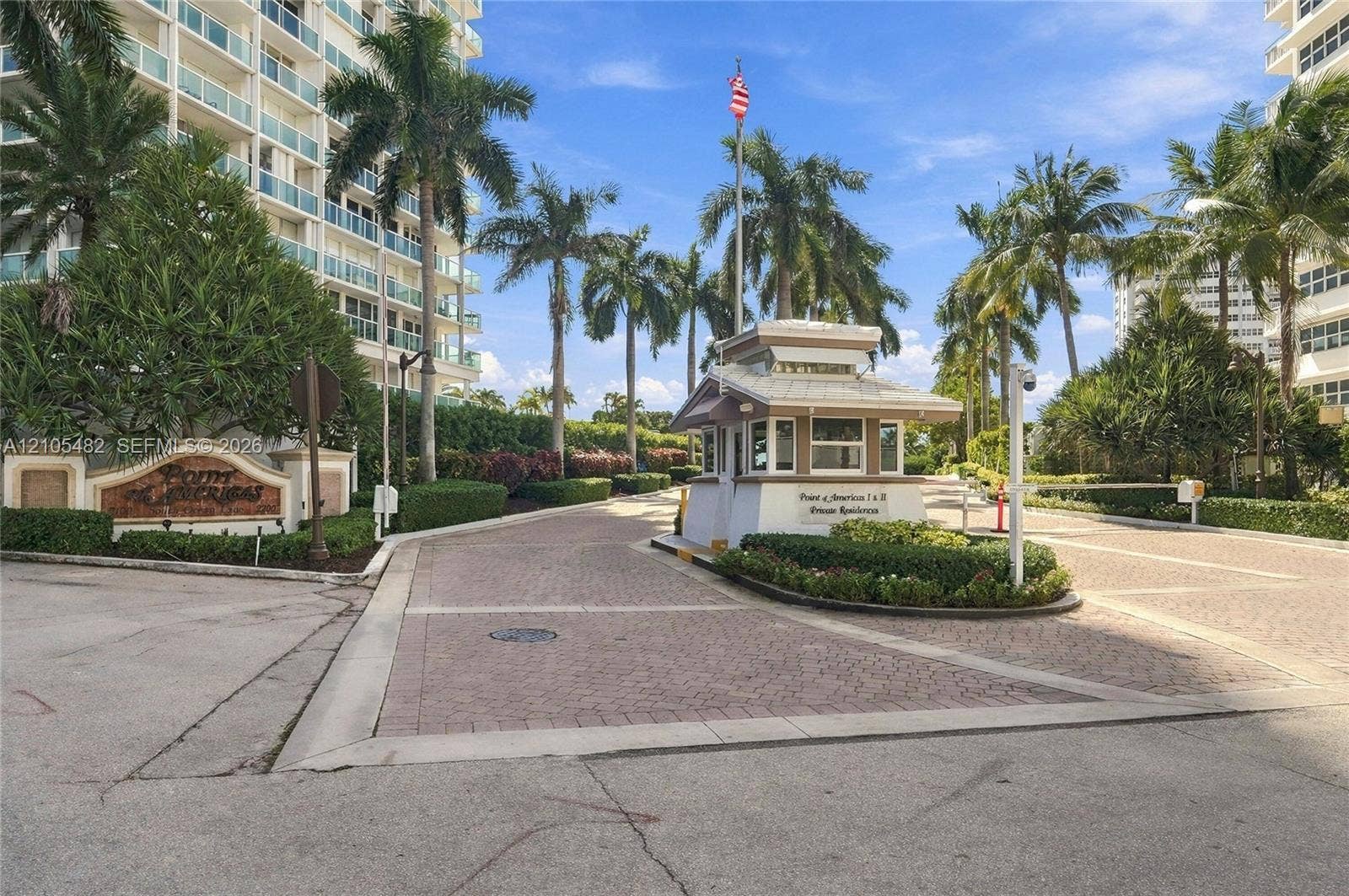 2100 S Ocean Lane, #808, Fort Lauderdale, FL 33316 Gated entrance featuring a security guardhouse, paver-stone driveway, and mature landscaping