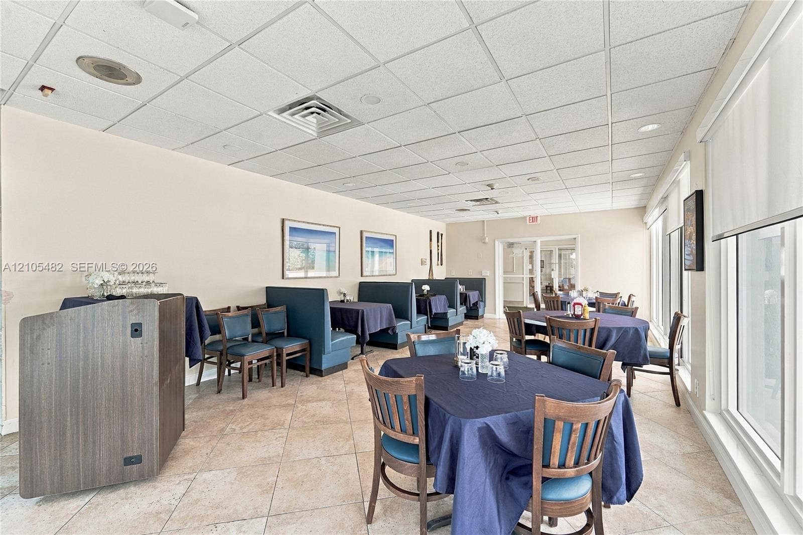 2100 S Ocean Lane, #808, Fort Lauderdale, FL 33316 Spacious interior room featuring tile flooring, a drop ceiling with recessed lighting, and a large window wall with retractable shades
