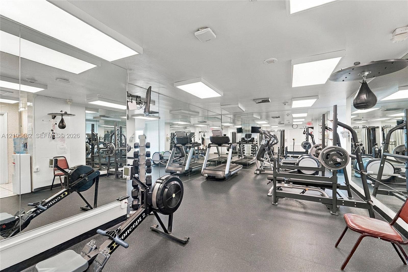 2100 S Ocean Lane, #808, Fort Lauderdale, FL 33316 Fitness facility featuring extensive wall-to-wall mirrors, durable rubberized flooring, and multiple recessed LED lighting fixtures