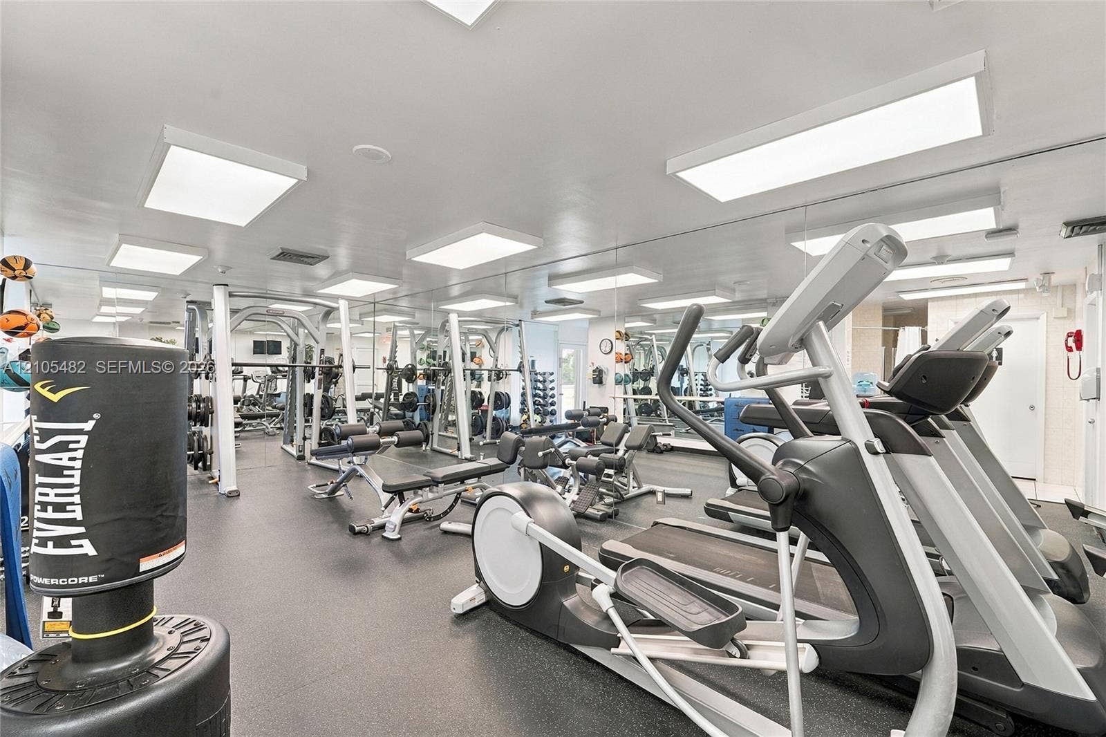 2100 S Ocean Lane, #808, Fort Lauderdale, FL 33316 Dedicated fitness area featuring rubberized flooring, wall-to-wall mirrors, and flush-mount panel lighting
