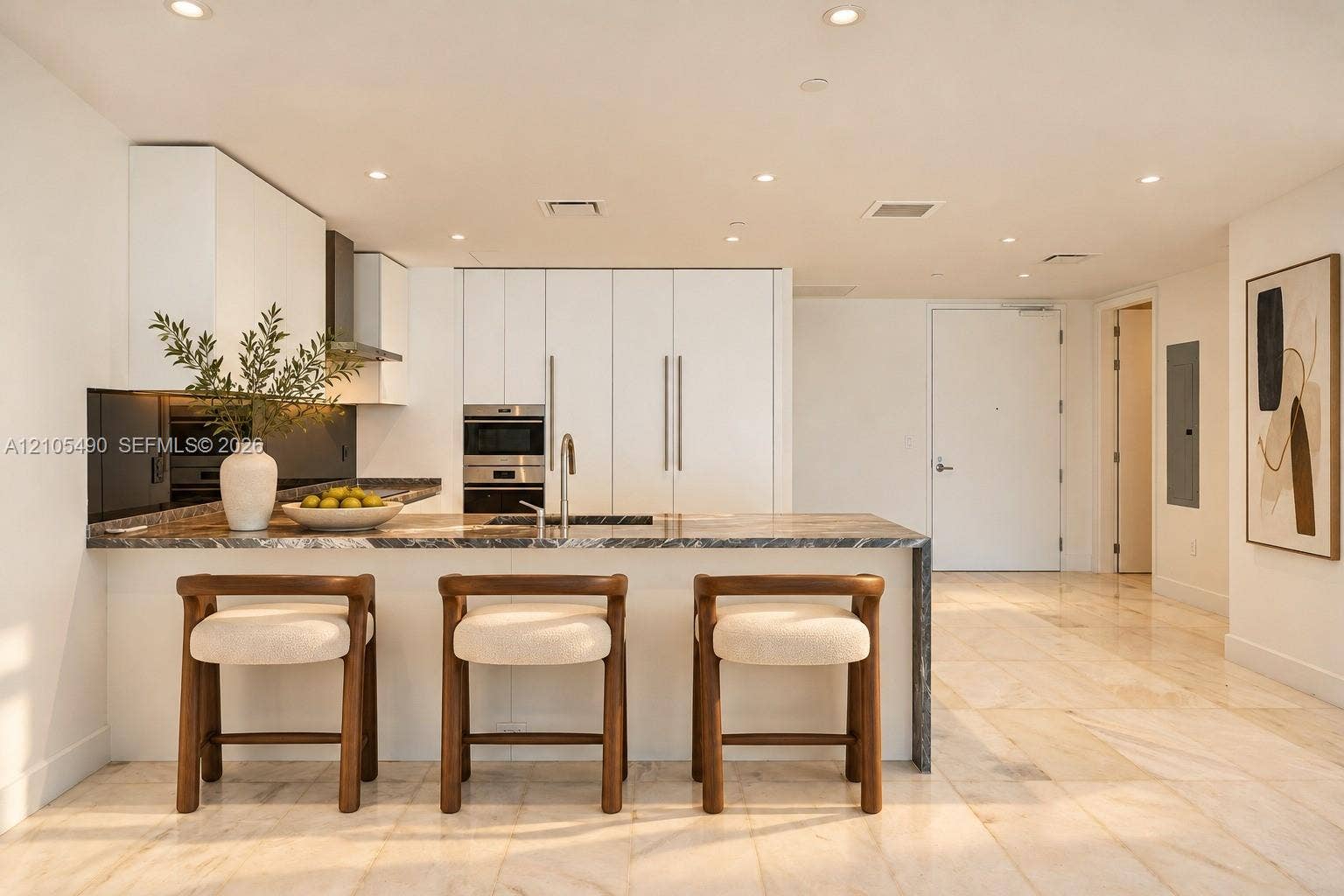700 NE 26th Terrace, #3603, Miami, FL 33137 Modern kitchen featuring flat-panel cabinetry, stone countertops, integrated stainless steel appliances, recessed lighting, and large-format tile flooring