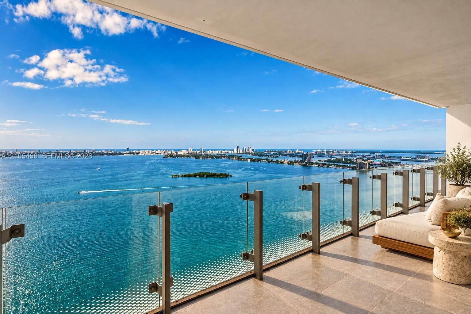 700 NE 26th Terrace, #3603, Miami, FL 33137 Private balcony featuring large-format tile flooring and a frameless glass railing system with metal hardware