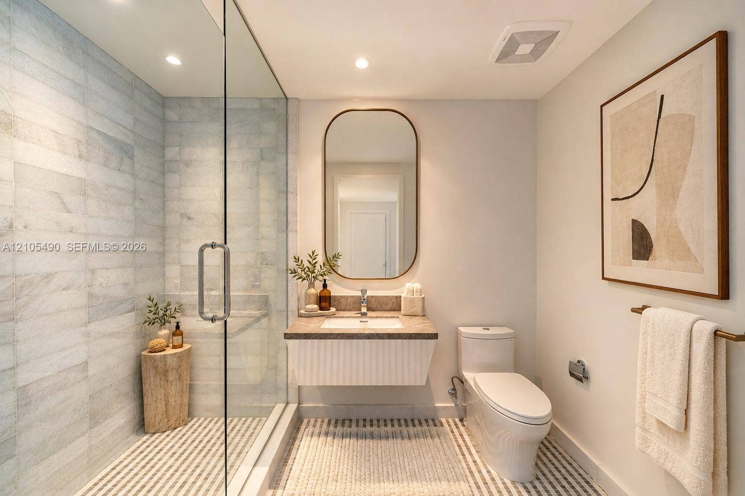 700 NE 26th Terrace, #3603, Miami, FL 33137 Glass-enclosed shower with horizontal wall tile, floating vanity with a stone countertop, integrated sink, and an arched wall mirror