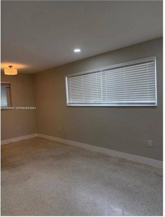 Recessed lighting, flush mount lighting fixture, single window, window blinds, light-colored walls