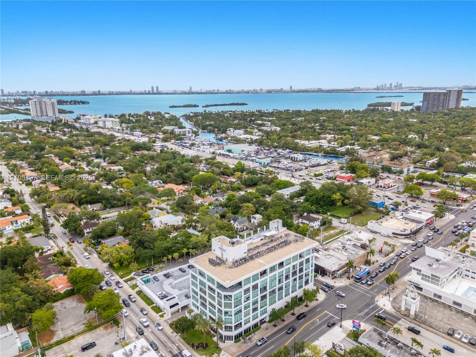 Waterfront properties with urban skyline backdrop