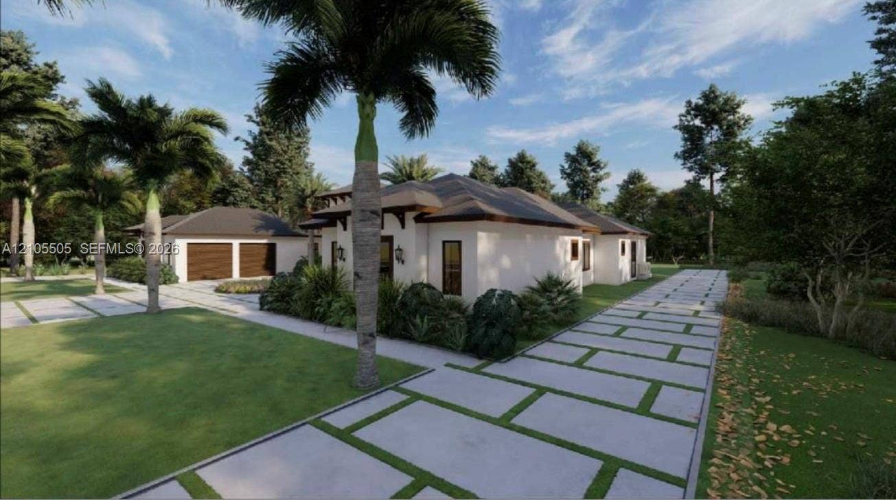 Extensive concrete paver driveway, detached two-car garage with wood-finish doors, stucco exterior, dark roof, and mature palm trees