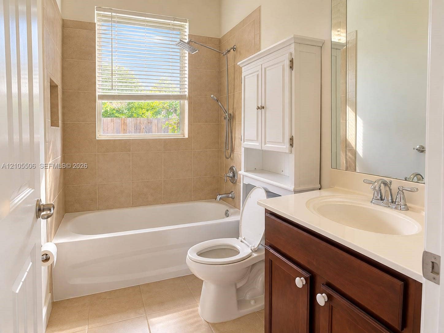 White vanity with an integrated sink and chrome fixtures