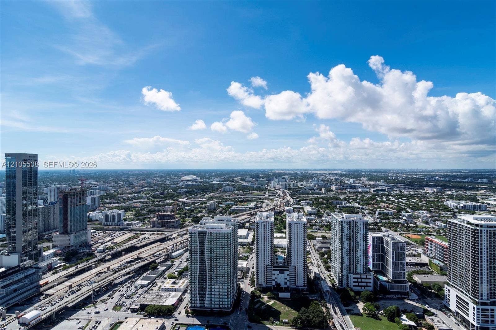 Expansive urban landscape with high-rise buildings and extensive transportation infrastructure