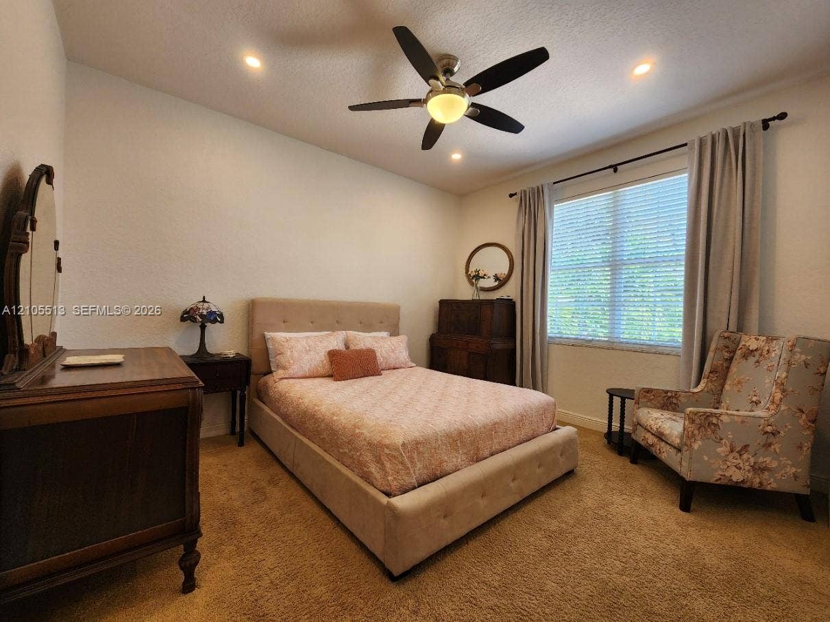 A 2nd Floor Guest Suite and private bath w/Vaulted ceiling, recessed lighting and ceiling fan