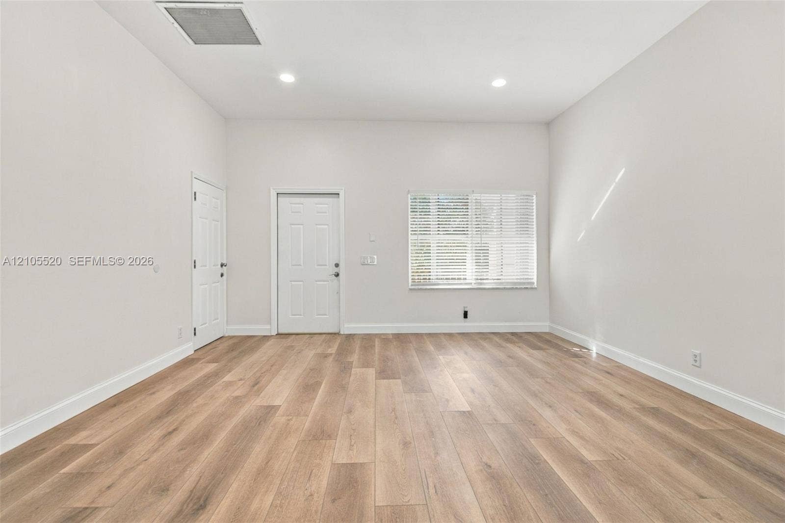 649 Willow Bend Road, Weston, Weston, FL 33327 Neutral interior featuring wood-finish flooring, recessed lighting, and a multi-pane window with blinds