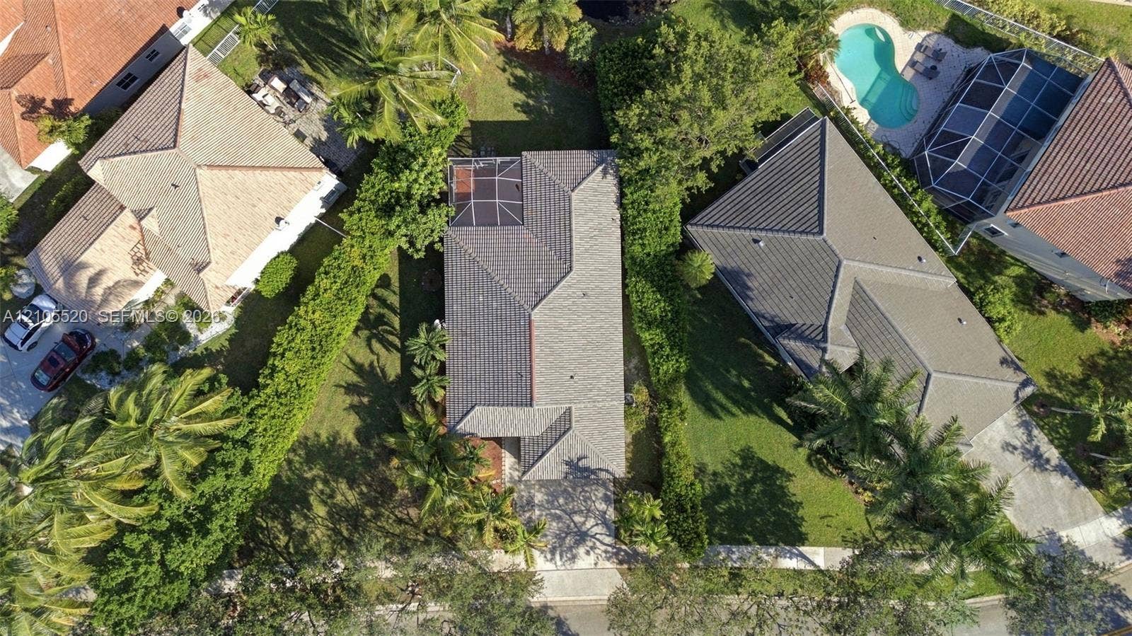 649 Willow Bend Road, Weston, Weston, FL 33327 Aerial perspective featuring a tile roof, concrete driveway, and enclosed rear lanai