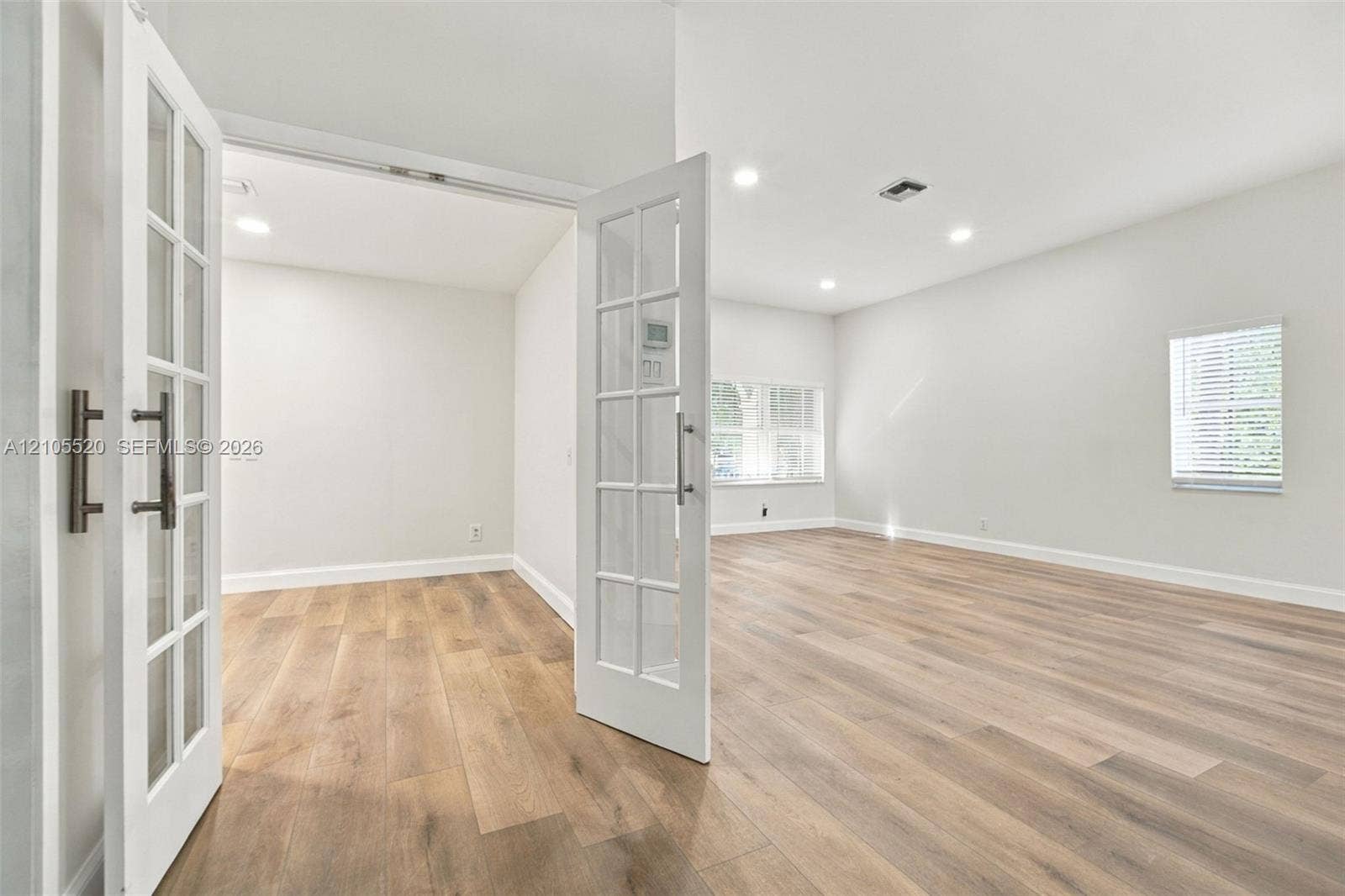649 Willow Bend Road, Weston, Weston, FL 33327 Wood-finish flooring, white French doors with glass panes, recessed lighting, and windows with horizontal blinds