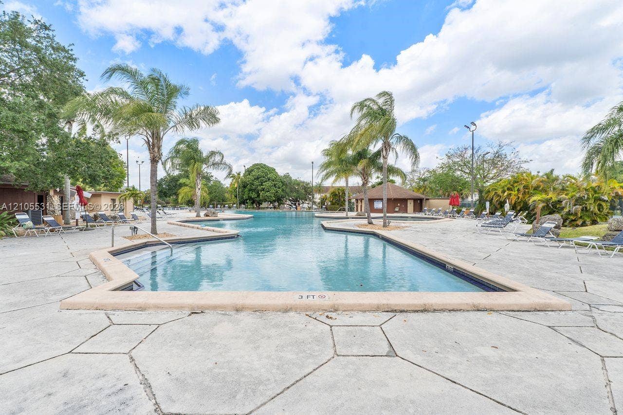 Expansive, free-form swimming pool with integrated spa