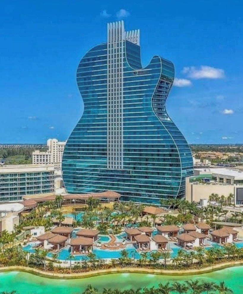 Unique guitar-shaped high-rise structure featuring a glass facade