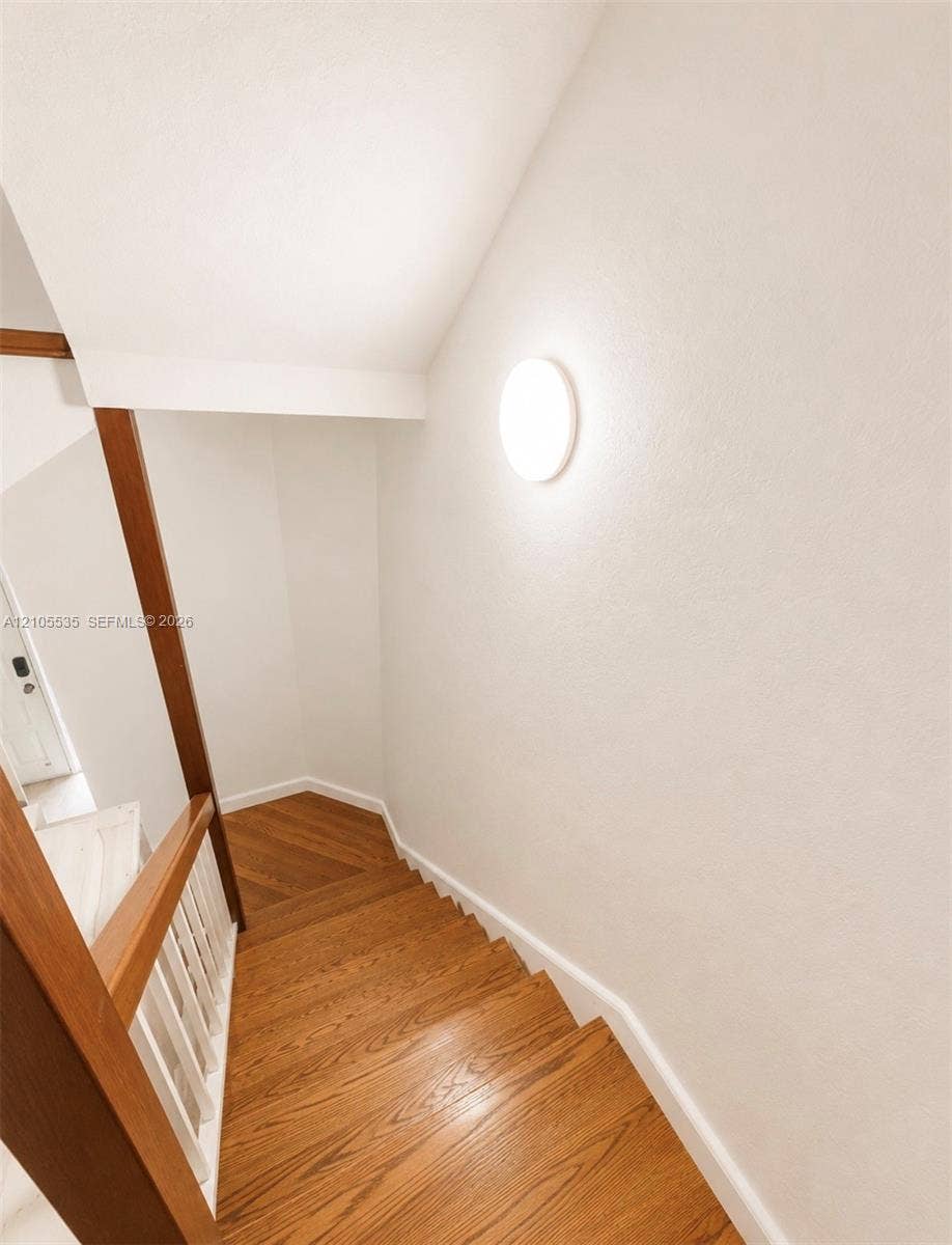 Wood-finish staircase with white risers