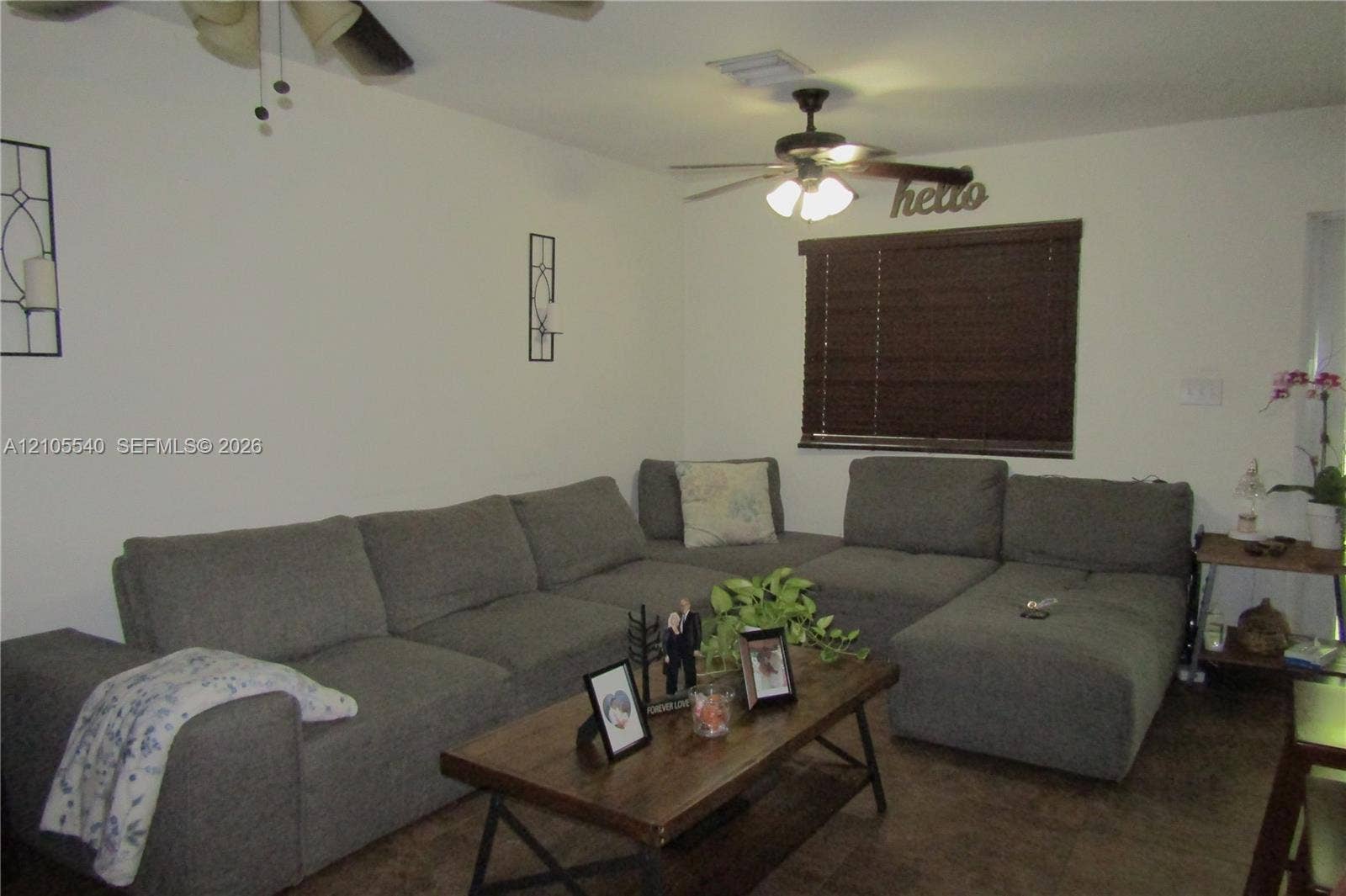 21935 SW 102nd Avenue, Cutler Bay, FL 33190 Ceiling fan with integrated lighting, recessed lighting, wood-finish flooring, and window with dark wood-toned blinds