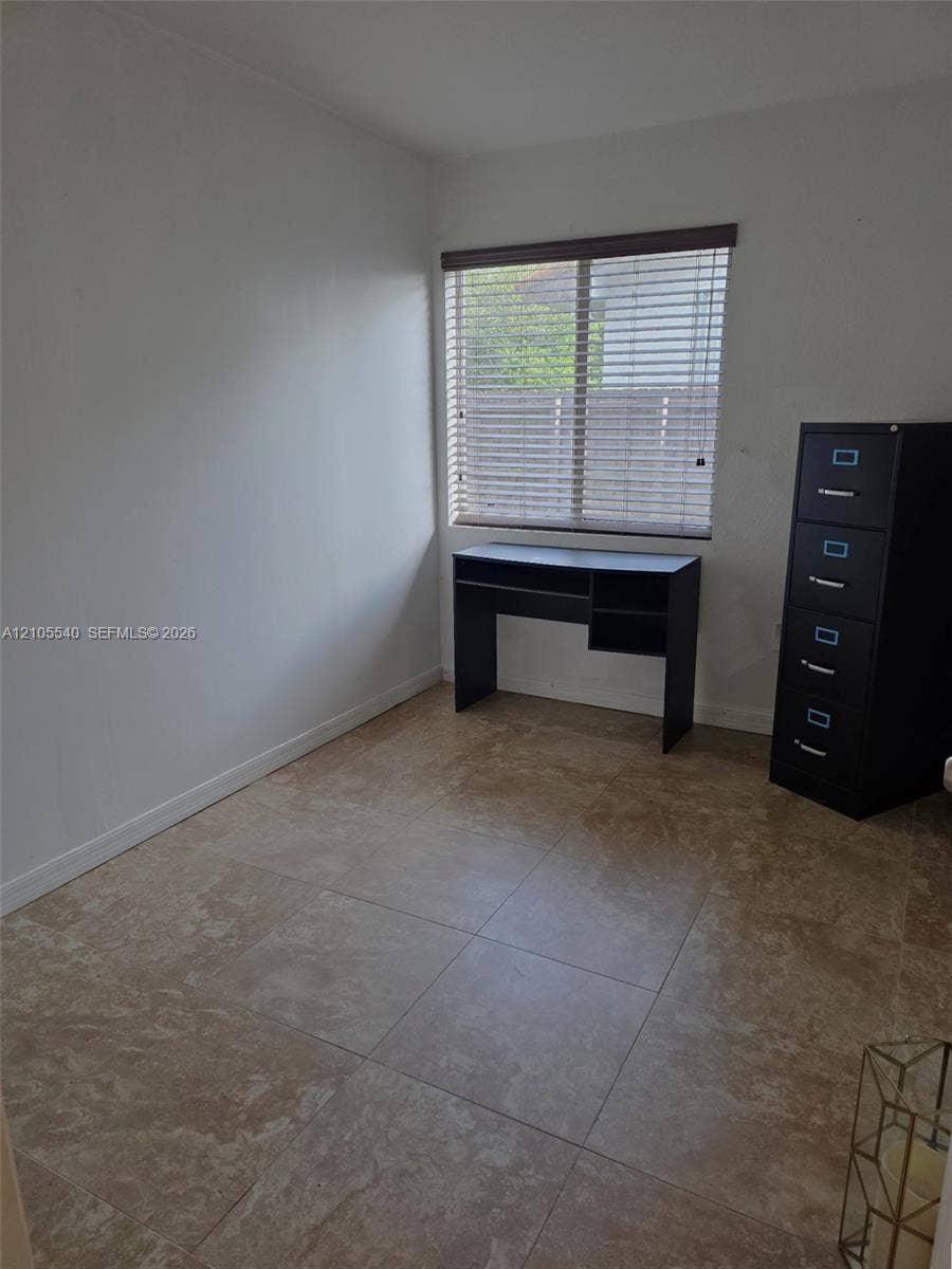 21935 SW 102nd Avenue, Cutler Bay, FL 33190 Tile flooring, neutral wall tones, and window with horizontal blinds