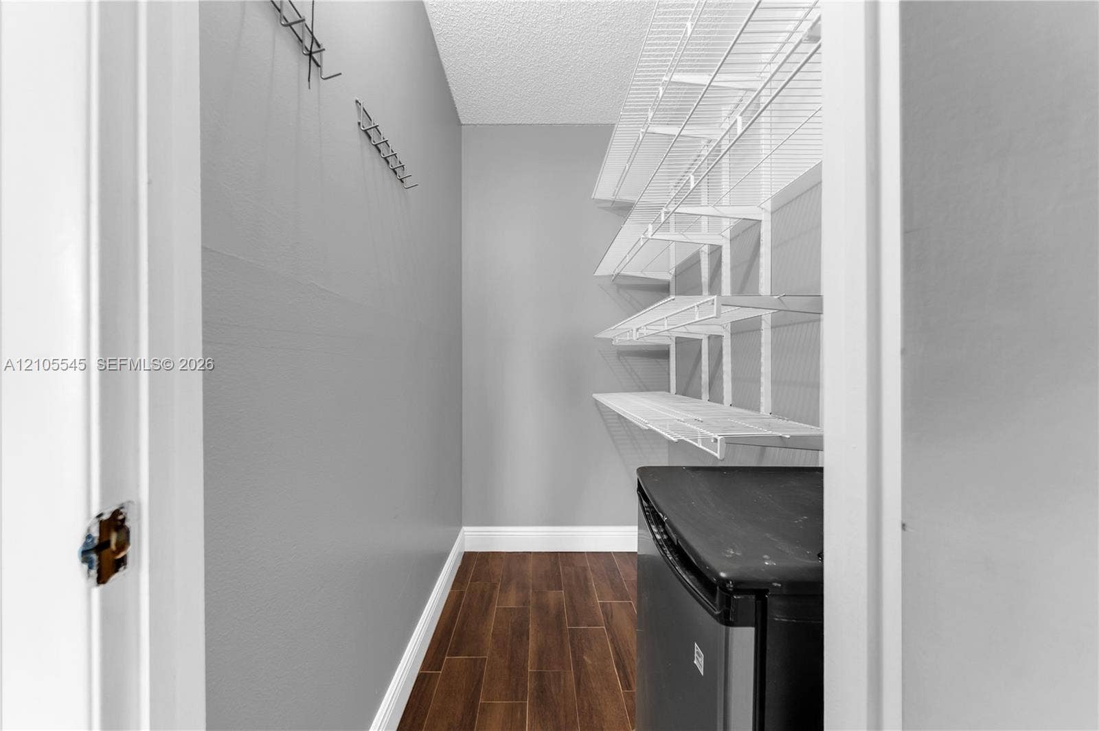 222 Tilford A, #222, Deerfield Beach, FL 33442 Wood-finish flooring with white trim, complemented by light gray walls