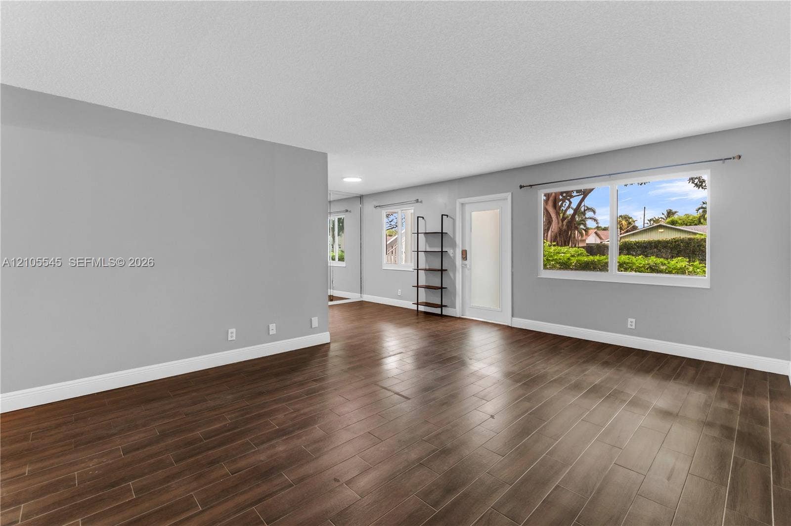 222 Tilford A, #222, Deerfield Beach, FL 33442 Wood-finish ceramic flooring throughout, complemented by light gray wall tones and white trim