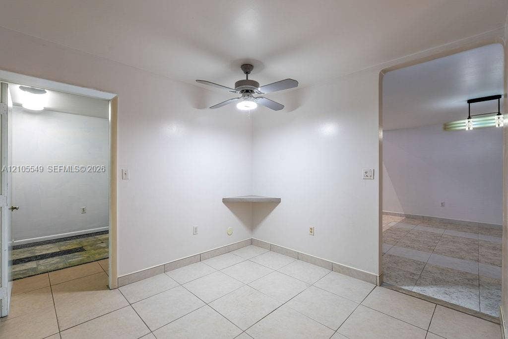 Ceramic tile flooring, ceiling fan with integrated lighting, built-in corner shelf