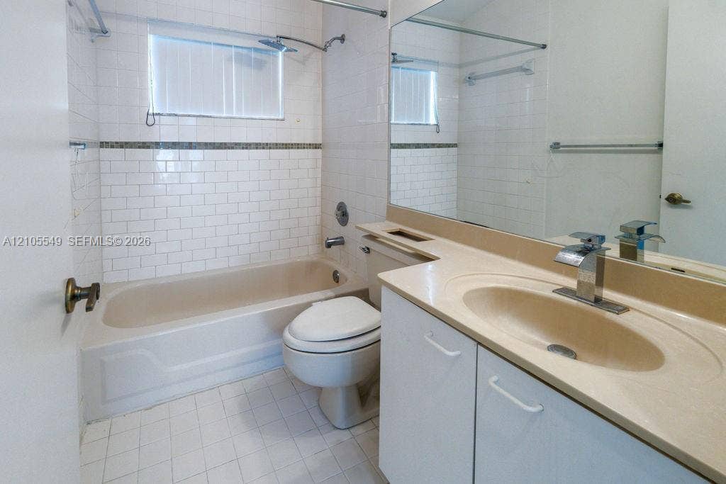 White subway tile surround with decorative accent band