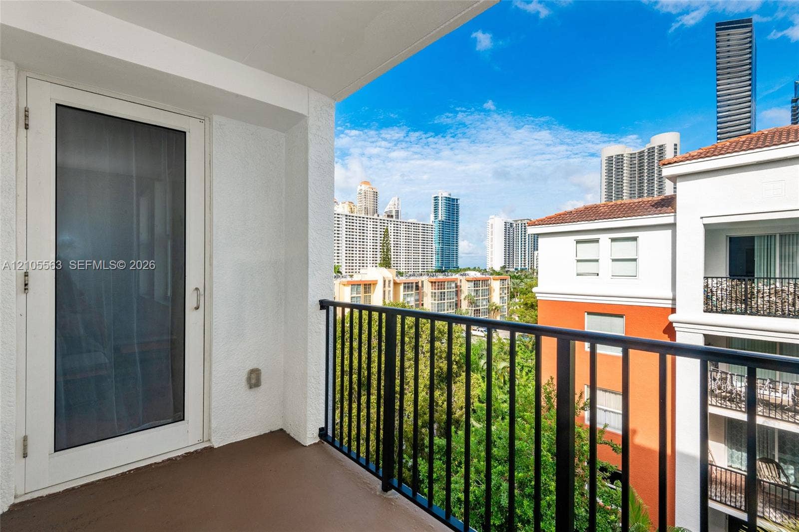 17145 N Bay Road, #4613, Sunny Isles Beach, Sunny Isles Beach, FL 33160 Private balcony with a metal railing, featuring a glass-paneled door