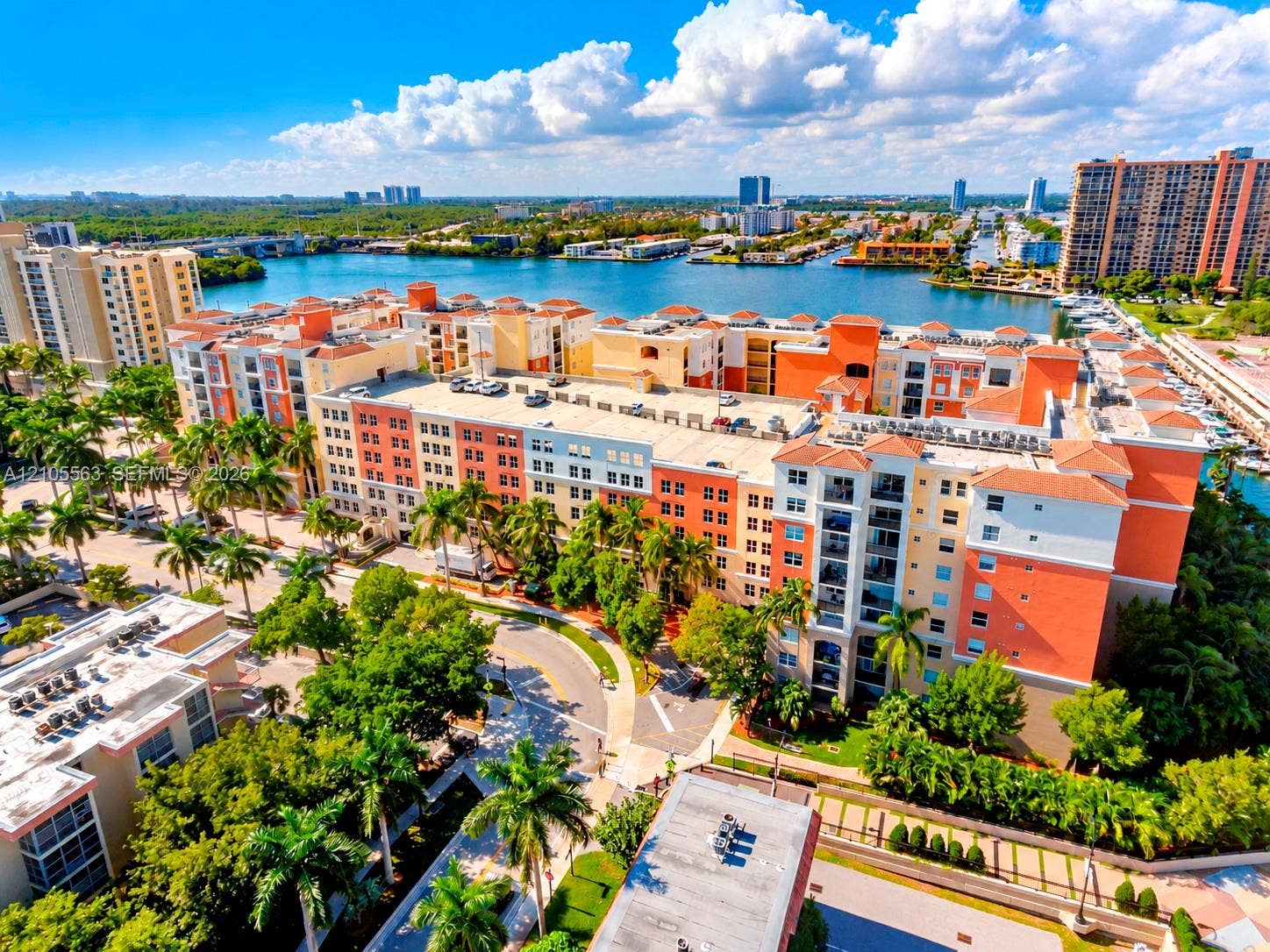 17145 N Bay Road, #4613, Sunny Isles Beach, Sunny Isles Beach, FL 33160 Multi-story residential complex with Mediterranean-style architecture, featuring tiled roofs and private balconies