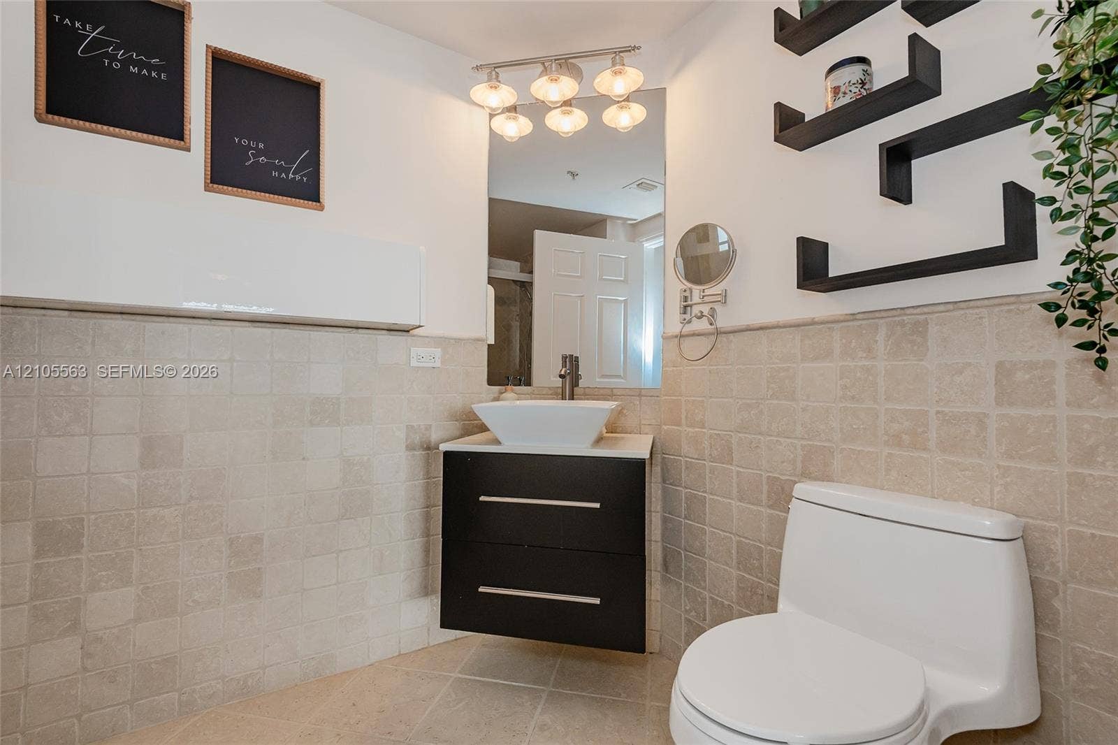 17145 N Bay Road, #4613, Sunny Isles Beach, Sunny Isles Beach, FL 33160 White vanity with a rectangular vessel sink, vanity light fixture, and wall-mounted shelves