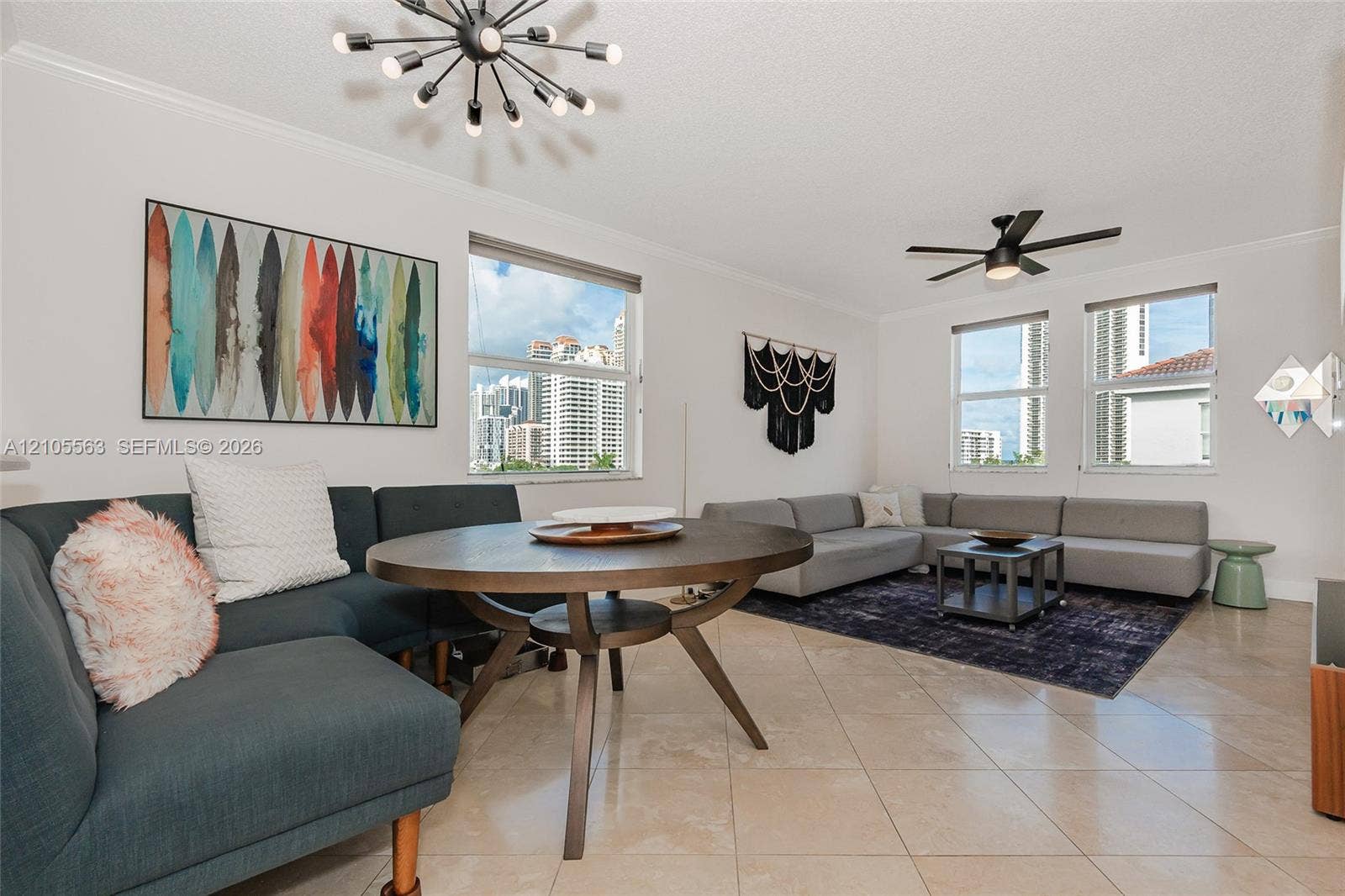 17145 N Bay Road, #4613, Sunny Isles Beach, Sunny Isles Beach, FL 33160 High ceilings with crown molding, ceiling-mounted fan, multiple windows, and tile flooring